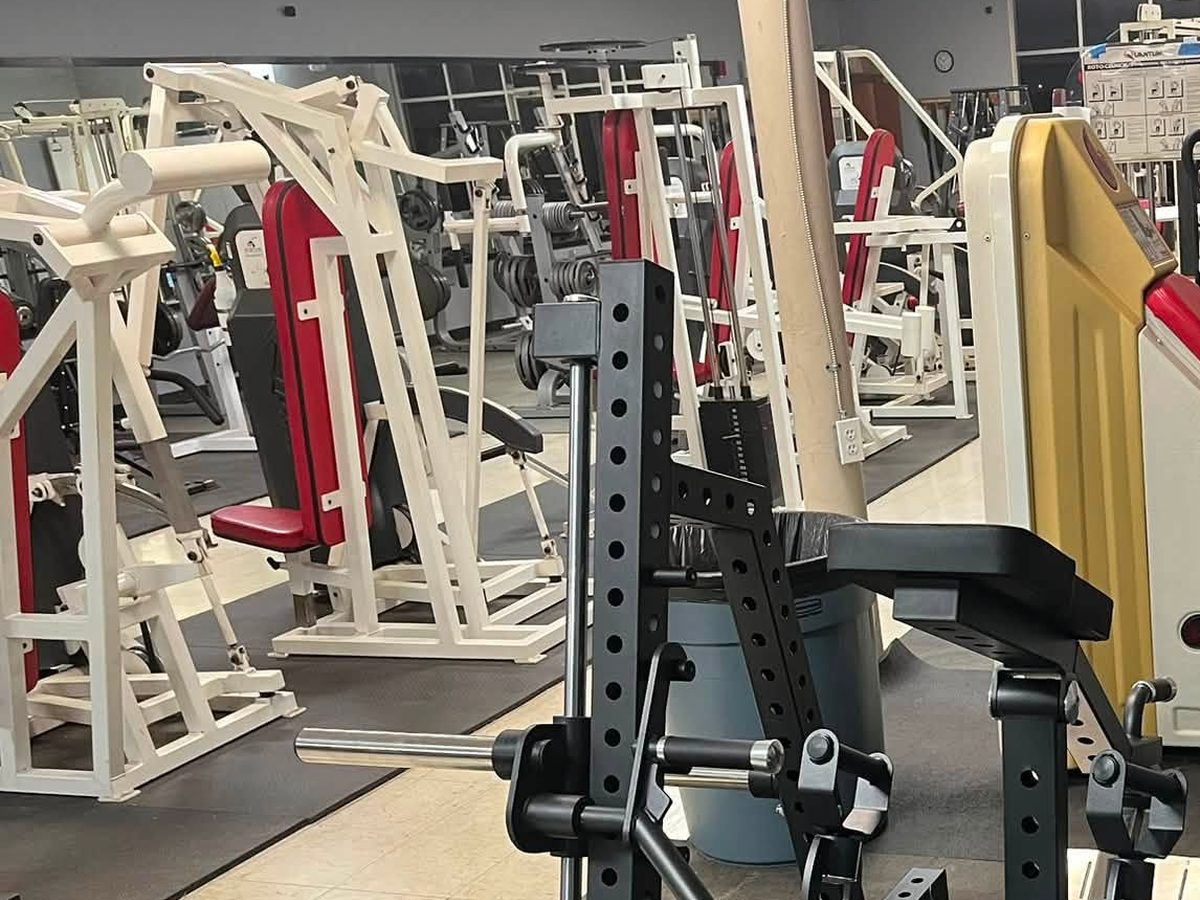 Plate-loaded strength machines and 45-degree leg press at Iron Forge Fitness